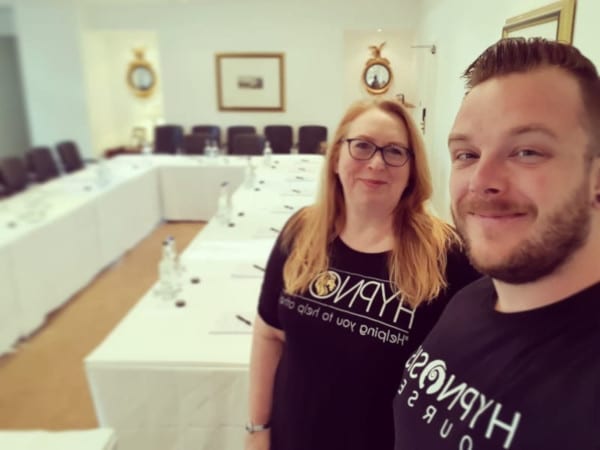 Rory Z Fulcher and Dr Kate Beaven-Marks standing in the hypnotherapy training room