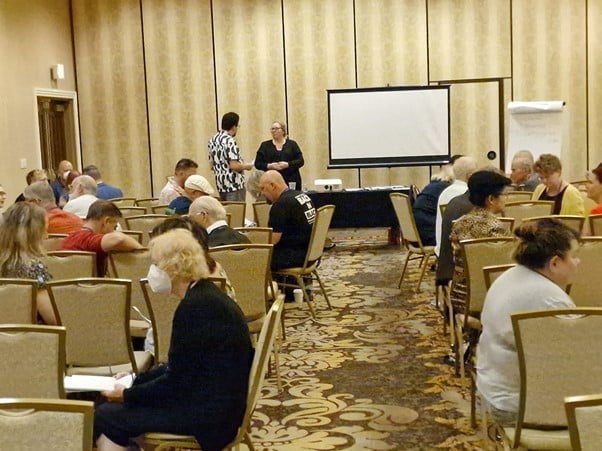 Dr Kate teaching Hypno-EMDR; a combination of hypnotherapy and EMDR. The picture shows one of the convention rooms at the Orleans Hotel in Las Vegas at the Hypnothoughts conference with a very swirly patterned carpet.