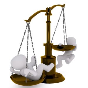 Two figures on balance scales - best hypnotherapy course blog.