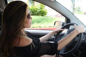 What is hypnotherapy used for? Woman driving a car after driving anxiety. 