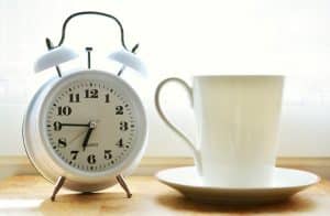 Work-life balance tip 1 - time management, picture of clock and mug